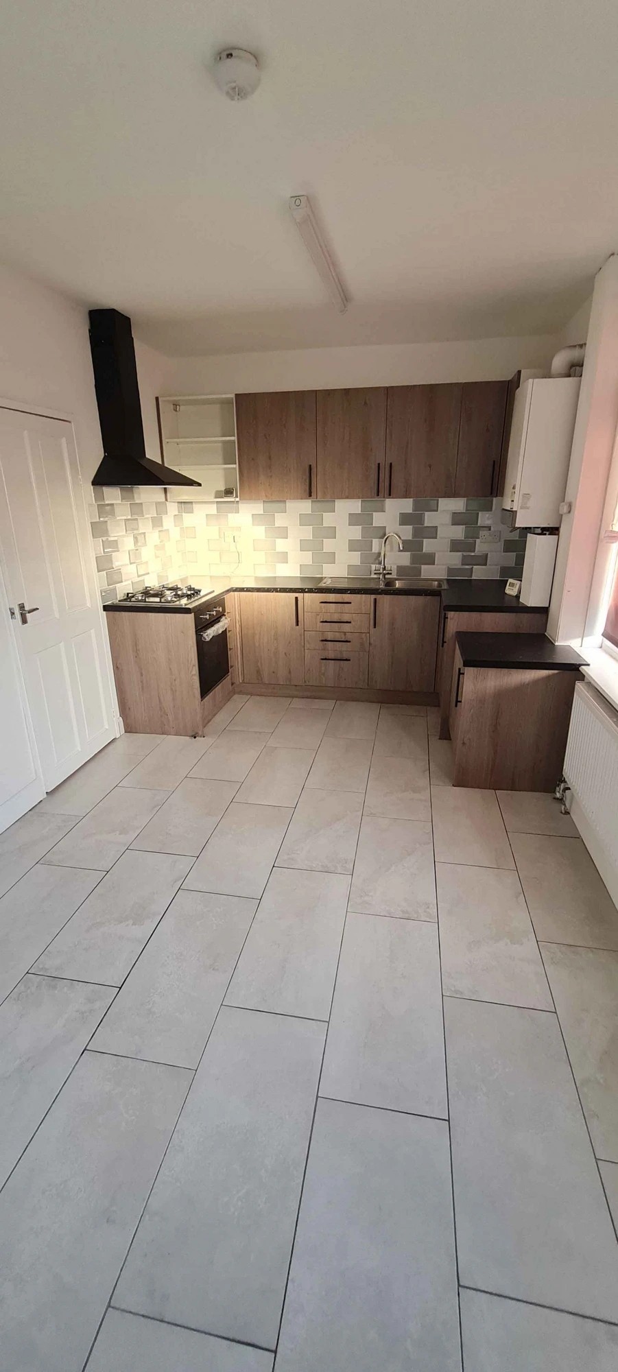 Installation of New Kitchen and Floor Tiling